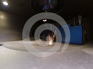 Metal is sintered under the action of laser into desired shape