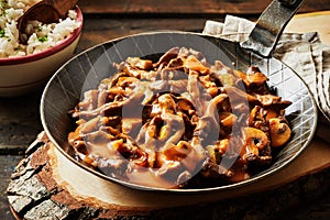 Metal skillet filled with rich beef stroganoff
