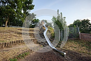 Metal slide installed on the children playground in the Prater park. Vienna Austria