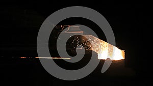 Metal sparks from hot metal. Molten steel sparks. Iron and steel industry