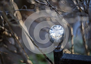 Metal sphere pommel fence with twigs