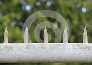 Metal spikes on top of security fence