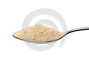 Metal spoon with with breadcrumb close up on white background