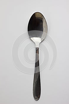metal spoon close-up on white background