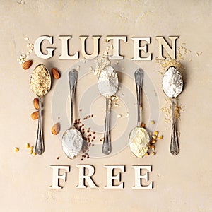 Metal spoons of various gluten free flour almond flour, oatmeal flour, buckwheat flour, rice flour, corn flour and