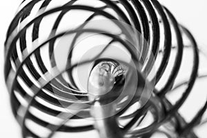 Metal spring coiled, black and white macro shot photo