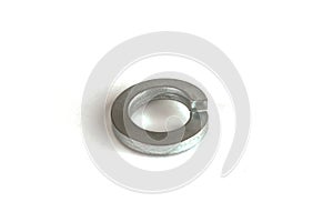 Metal spring washer lies isolated on white background