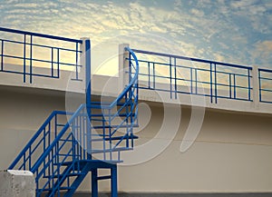 METAL STAIR WITH SKY BACKGROUND