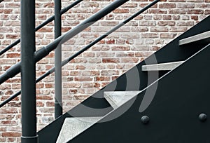Metal staircase against a brick wall