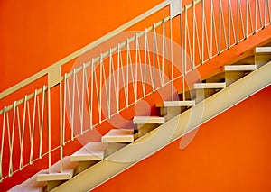 Metal stairs on the big orange wall