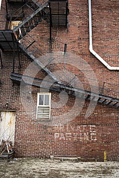 Metal stairs on brick building