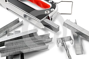 Metal staples for stapler gun on white background close up