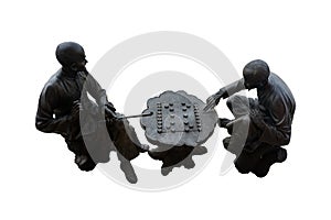 Metal statue of two chinese old men playing chess isolated on white background with clipping path.