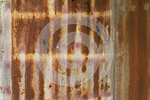 Metal steel strips. Rusty corrugated iron metal, Zinc steel wall, pattern texture background. Close-up of exterior architecture