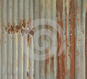 Metal steel strips. Rusty corrugated iron metal, Zinc steel wall, pattern texture background. Close-up of exterior architecture