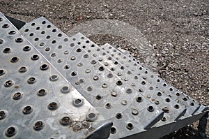 Metal steps leading to container at construction site