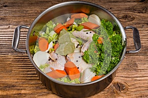 Metal stock pot with soup ingredients