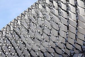 .metal structure building wall with blue sky in the background