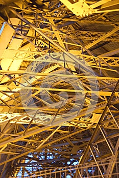 Metal structure of a roof with a complex shape on a sunny blue sky