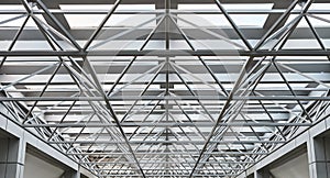 Metal structure supporting glass roof in a shopping mall