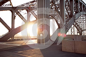 Metal structures of the bridge across river. Long-span steel trusses.