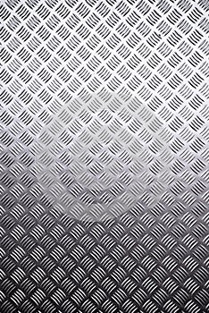 Metal surface background with repeative diamond pattern