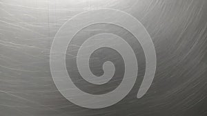 Metal surface with scratched lines and reflections