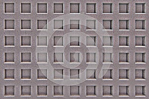 Metal surface with square holes and notches