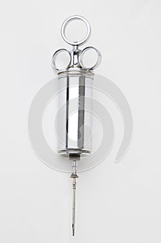 Metal syringe