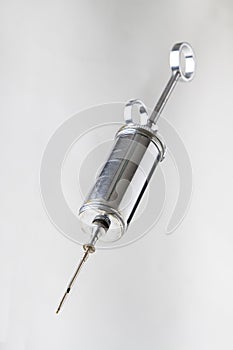 Metal syringe