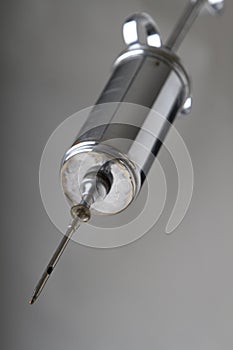 Metal syringe