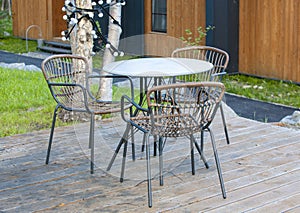 Metal table and chairs in garden. Close up