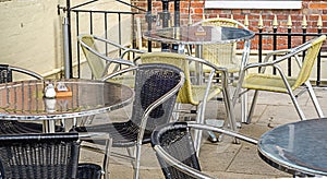Metal tables and wicker chairs, restaurant front, restaurant gar