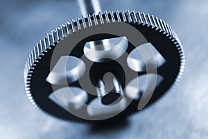 Metal teeth of a cogged wheel