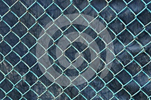 Metal texture of an old blue grid on a black background