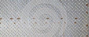 Metal texture of stainless steel floor plate with bumped diamond pattern