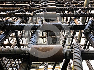 Metal threaded couplings connecting reinforcing rebars. Reinforcement framework