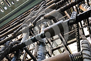 Metal threaded couplings connecting reinforcing rebars. Reinforcement framework