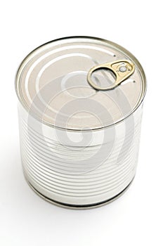 Metal tin can with green peas on a white background