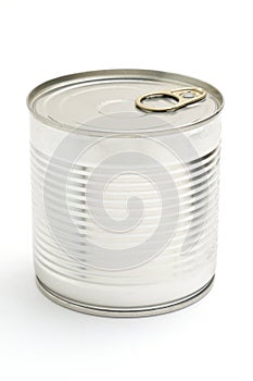 Metal tin can with green peas on a white background