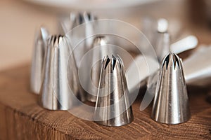 Metal tips, nozzles for a pastry bag. Equipment for the preparation of desserts.