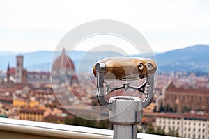Metal tower viewer against the Cathedral Dome of Florence, Italy