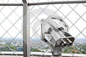 Metal tower viewer on observation deck, closeup. Space for text