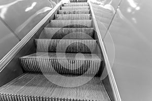 Metal treads on a moving escalator in a mall