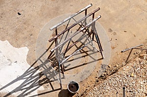 Metal trestles on a wet cement floor