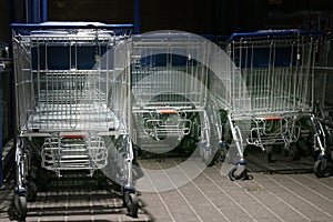 Metal trolleys at supermarket entrance