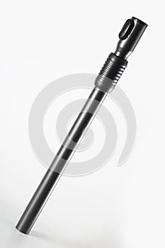 Metal tube bar black for vacuum cleaner, on a white background, selective focus