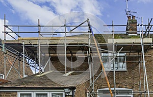 Metal tubular scaffolding around an urban semi detached house re photo