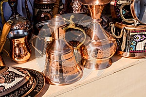 Metal Turkish pitchers, vases and containers next to each other