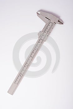 Metal vernier caliper on white background